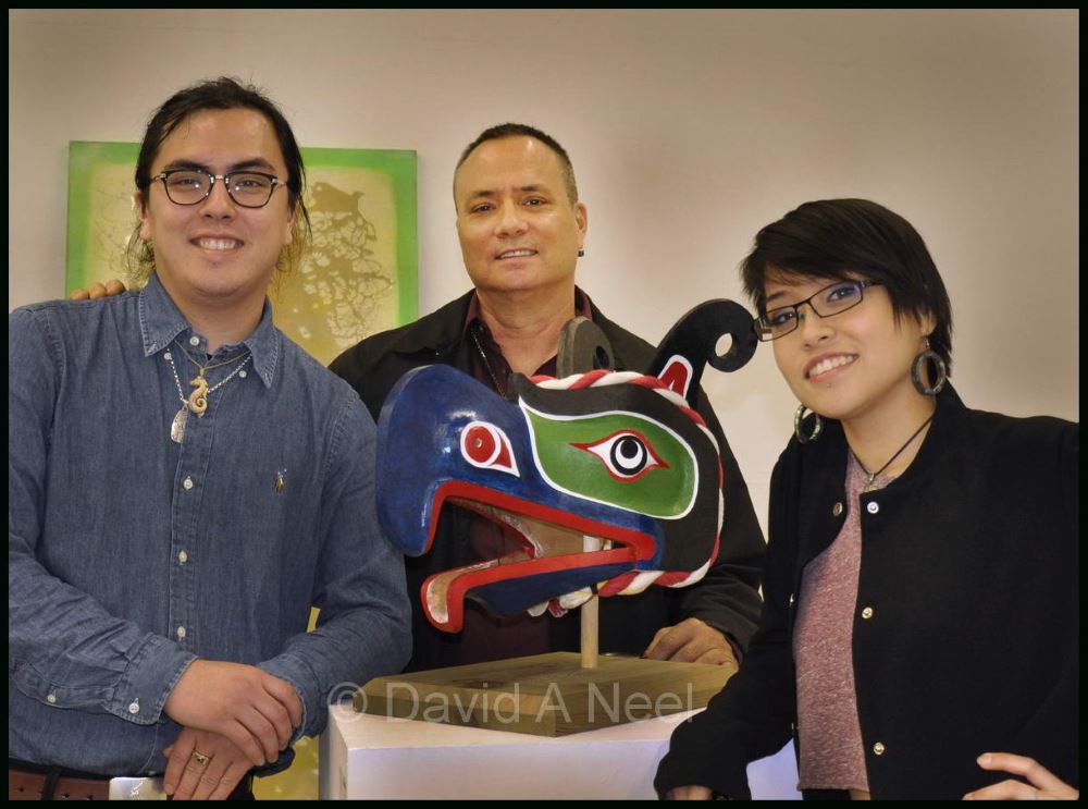 David, his son Edwin, and daughter Ellena, at the Emily Carr University graduation exhibition, with Edwin's Thunderbird mask.